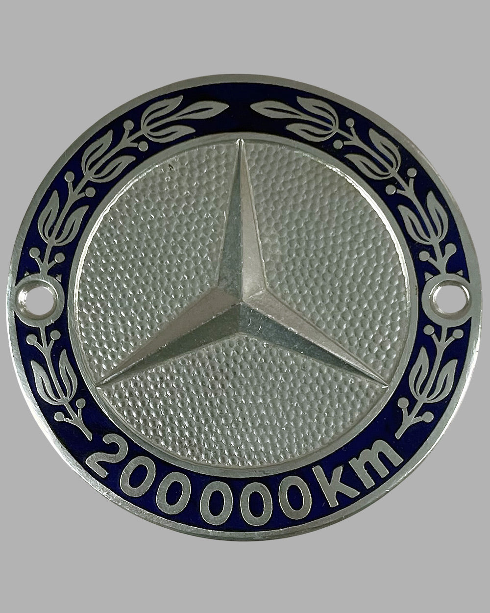Two Mercedes badges 2