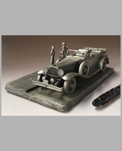 The Duesenberg Model J Pewter Sculpture by Raymond Meyers, left side and front