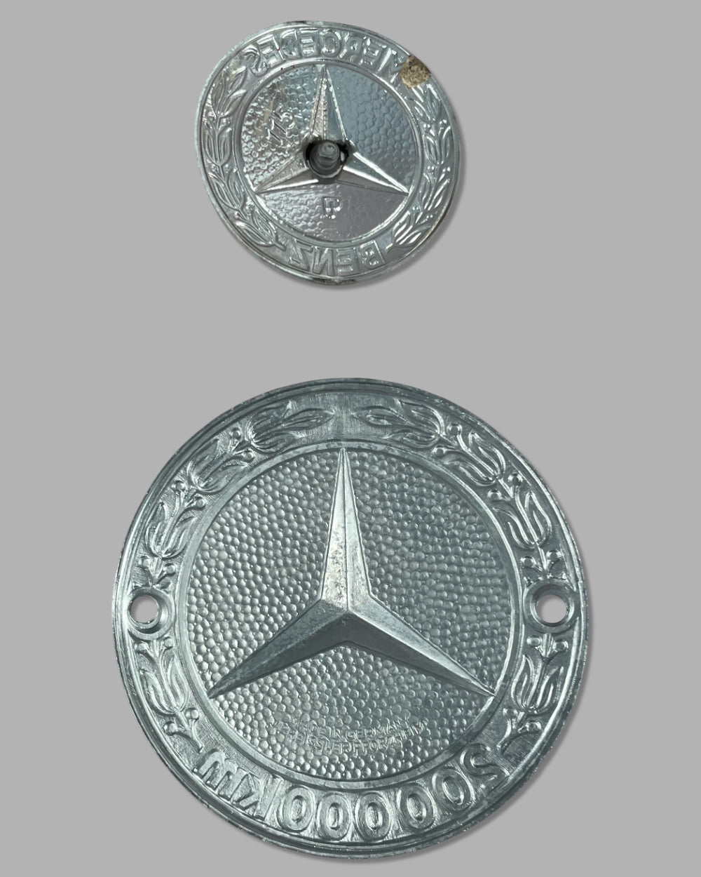Two Mercedes badges 4