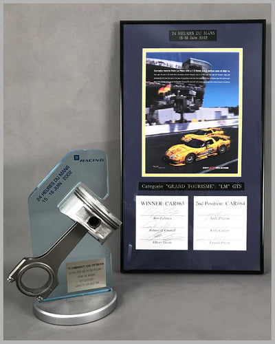 2002 - 24 Heures Du Mans Corvette Piston and Rod Assembly with ad copy, autographed by 6 drivers