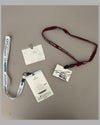 Three Herb Fishel credentials, autographed by Shelby, Stewart, Ickx, and Gurney