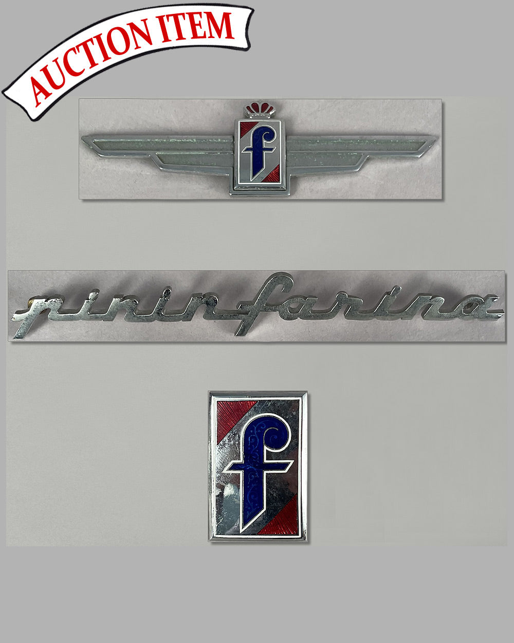 Three Pininfarina body badges and a script