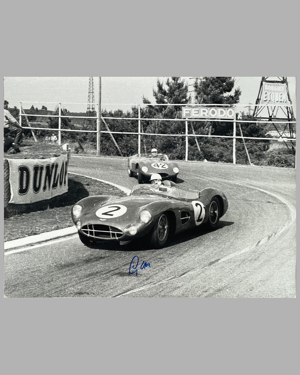 Stirling Moss piloting his Aston Martin DBR1 at Le Mans in 1958 b&amp;w photograph, autographed by Moss