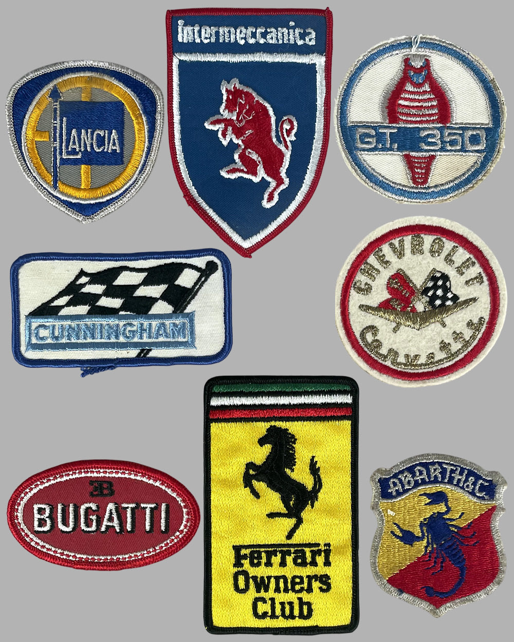Collection of 8 automobile marques patches