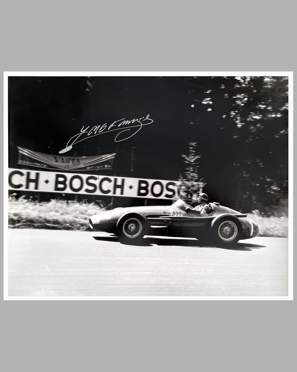 Fangio’s greatest victory autographed b&w photograph