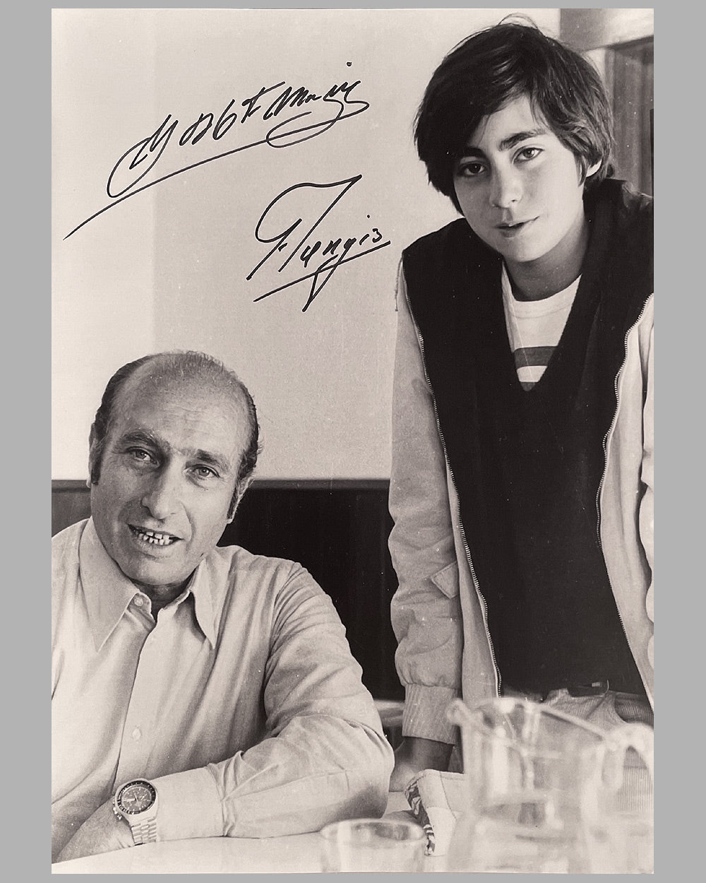 Juan Manuel Fangio with his nephew, Juan Manuel Fangio II b&amp;w photograph by Fernando Gomez, hand autographed by both