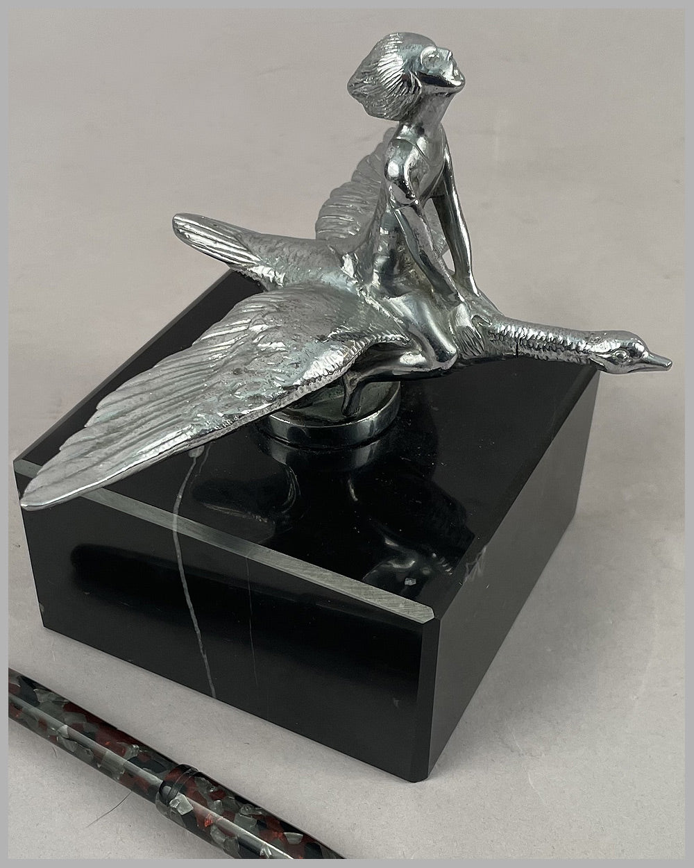 Young girl riding a goose mascot