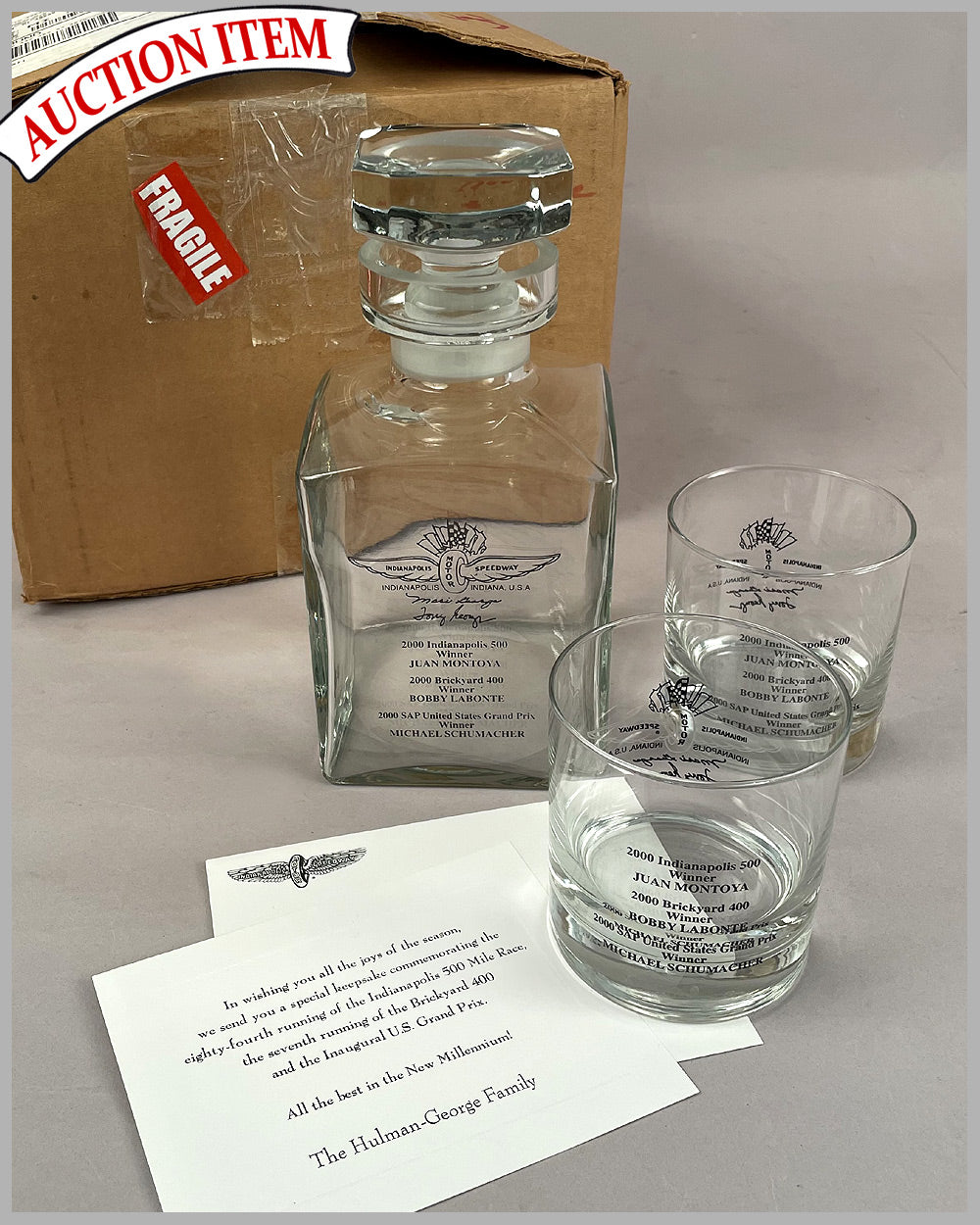 Set of Indianapolis Motor Speedway (IMS) whiskey glasses and decanter celebrating 3 wins in 2000