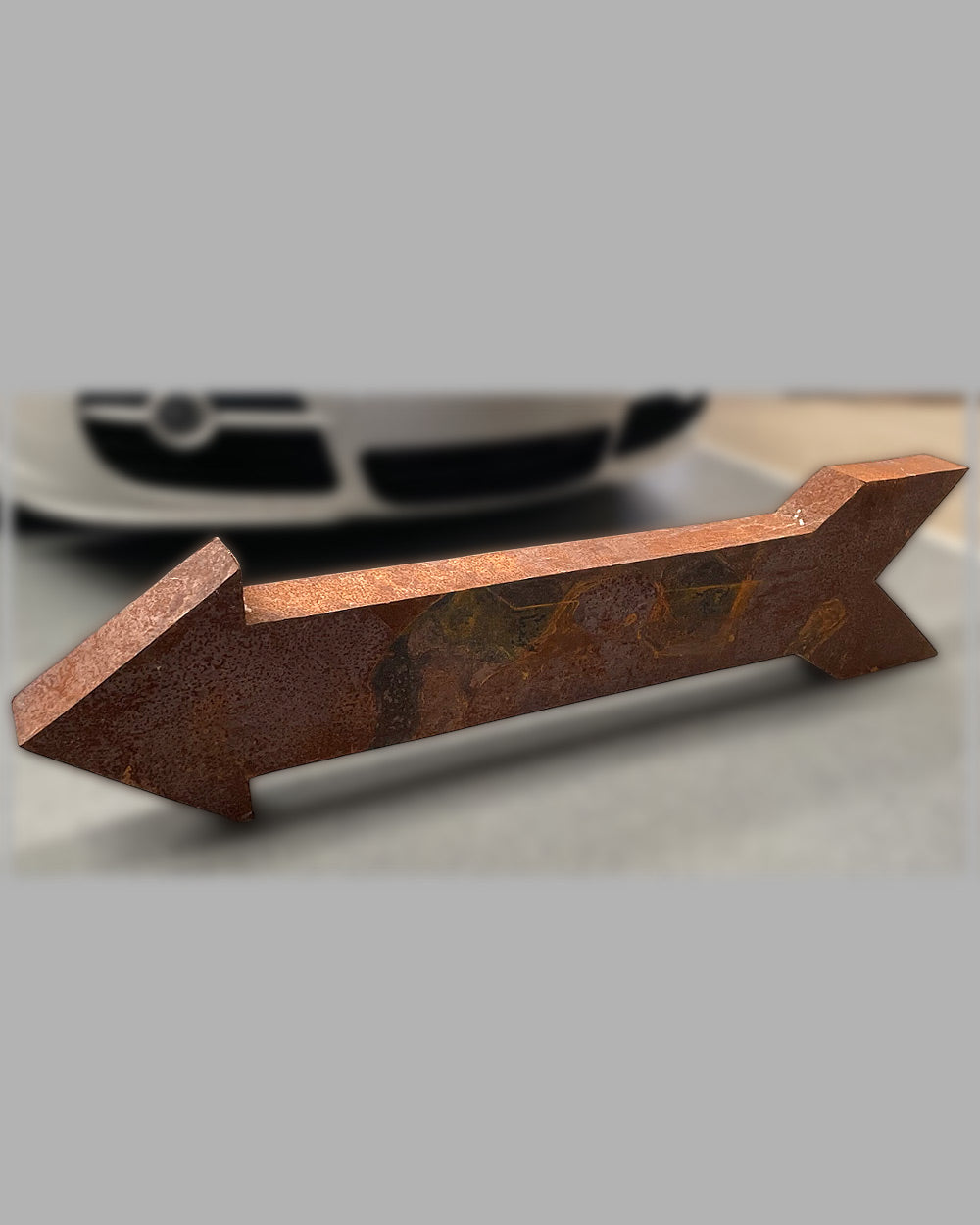 Large metal arrow sign