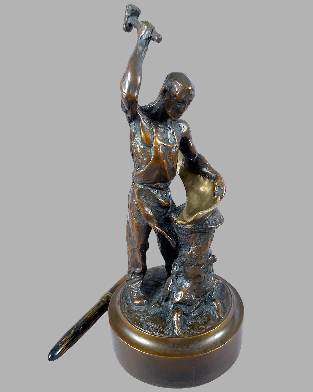 The Panel Beater bronze sculpture by Larry Braun, 1990