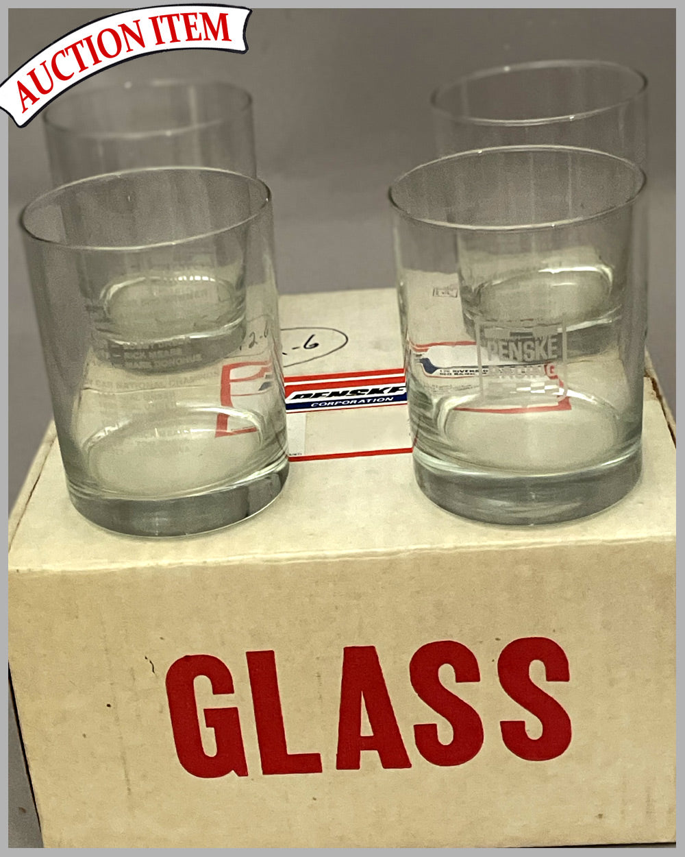 Four Penske racing cocktail glasses from 1987