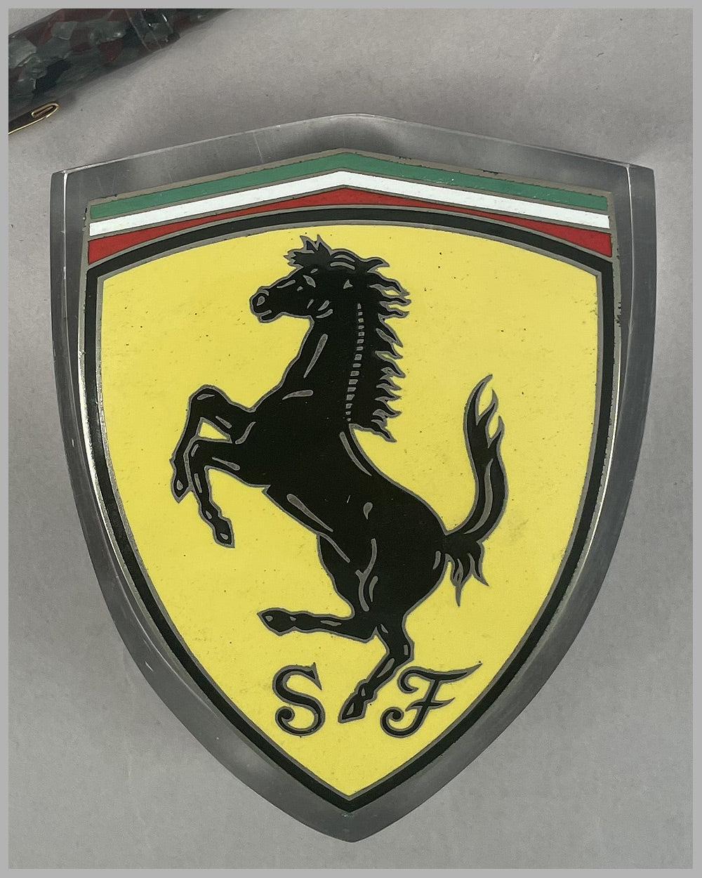 Scuderia Ferrari badge, curved for fender mounting