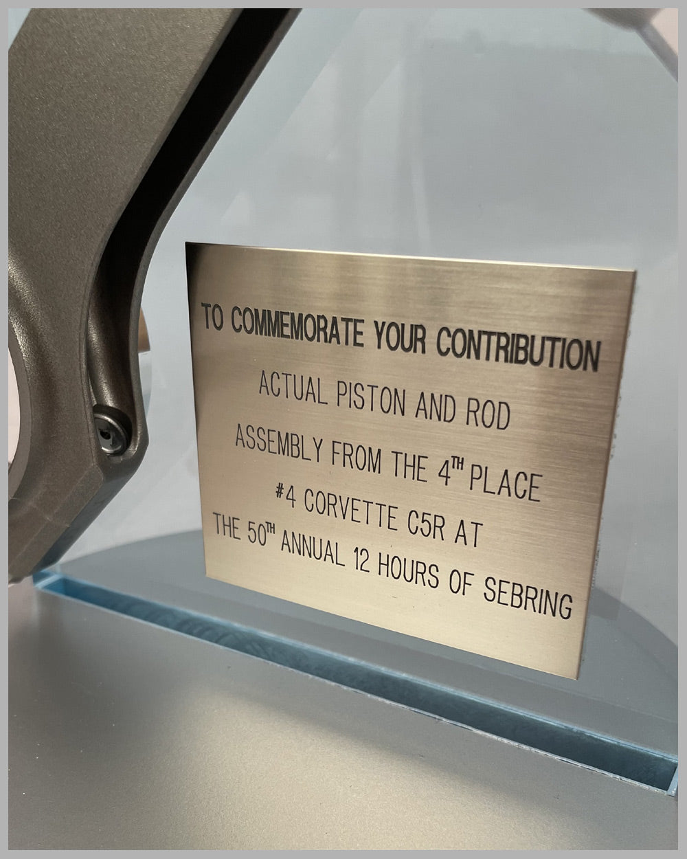 Piston and rod assembly from the Corvette C5R driven at the 50th 12 Hours of Sebring in 2002