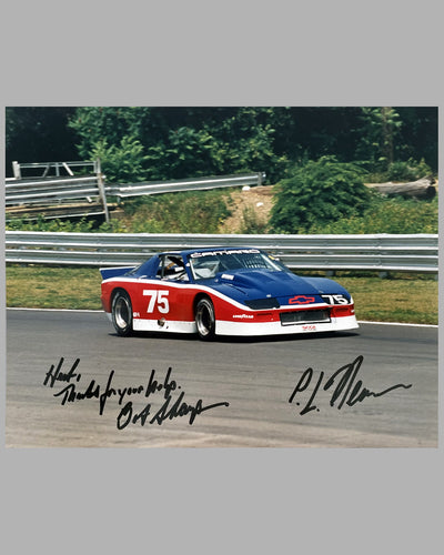 Unusual and rare color photograph of a Bob Sharp Chevrolet Camaro race car, autographed by Paul Newman