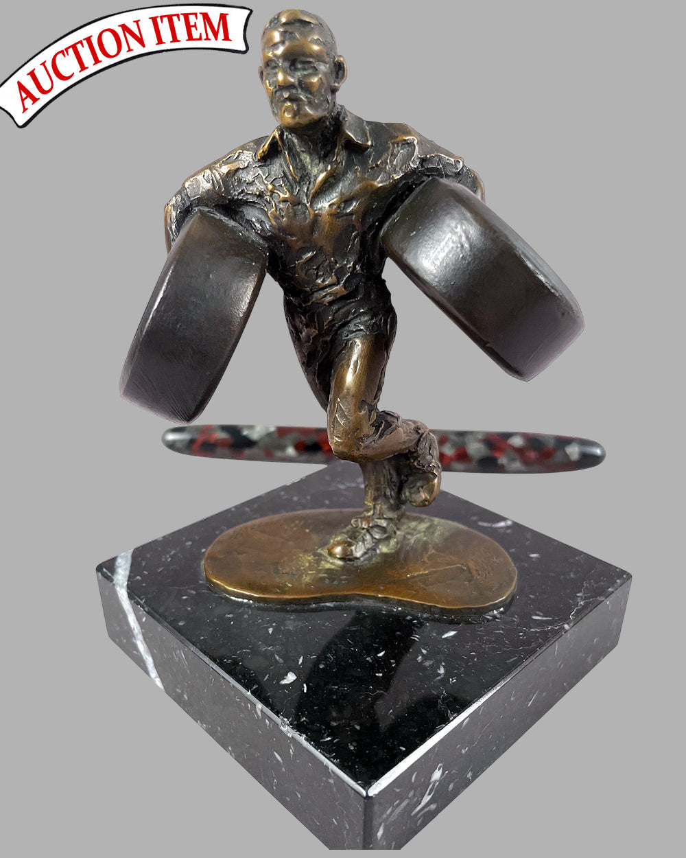 The Tire Changer bronze sculpture by Larry Braun, 1991