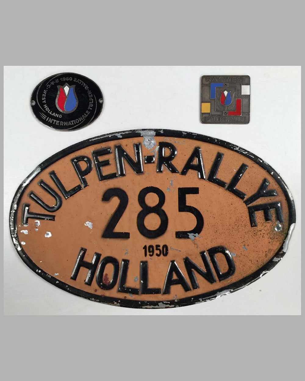 Two International Tulpen-Rallye badges and one rallye plaque