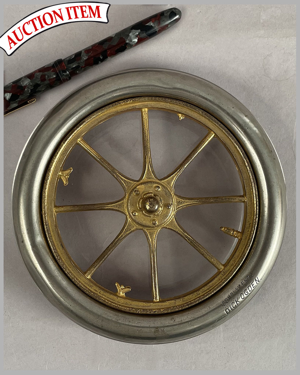 Glass ashtray depicting a wheel and tire
