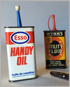 Four oil tin cans from Velox, Wynn’s, Esso, Outers 3