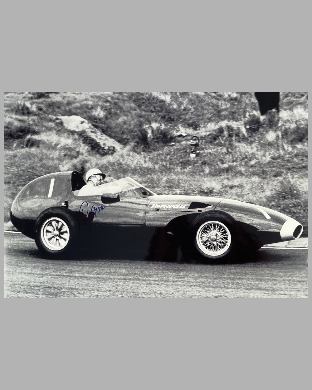 Stirling Moss in his Vanwall VW10 autographed photo by Geoffrey Goddard