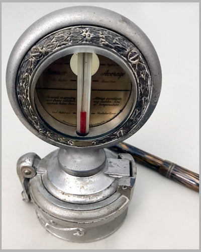 Large standard motometer by Boyce with attached revolving decorative hub cap