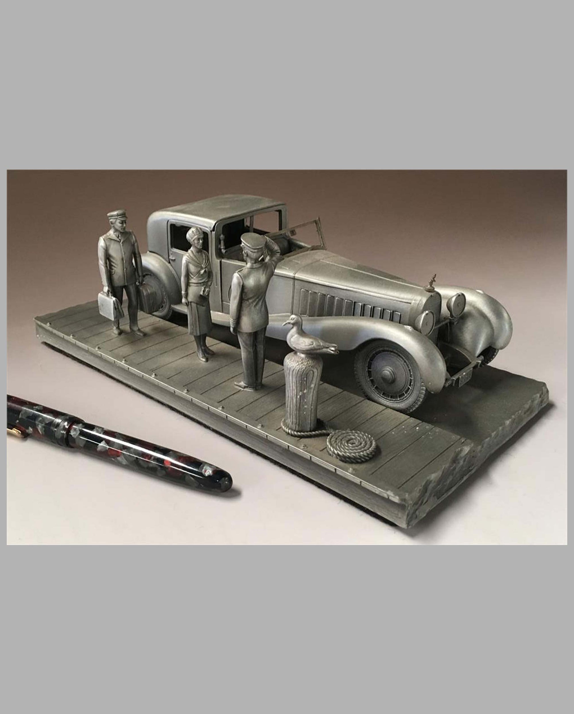 The Bugatti Royale Pewter Sculpture by Raymond Meyers, detailing wealthy couple and driver with luggage
