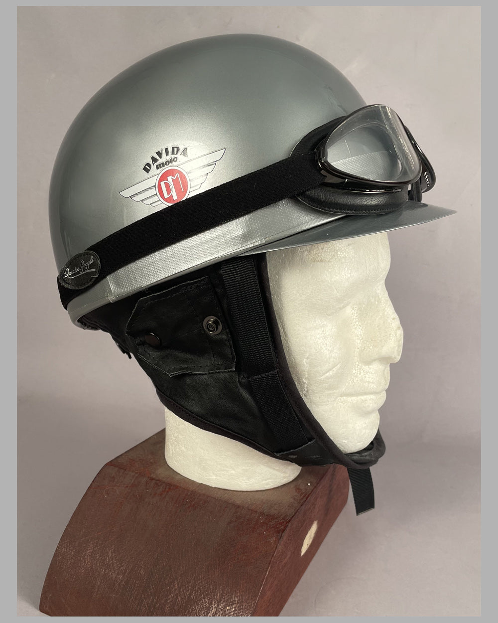 Open face helmet and large old fashioned aviator goggles