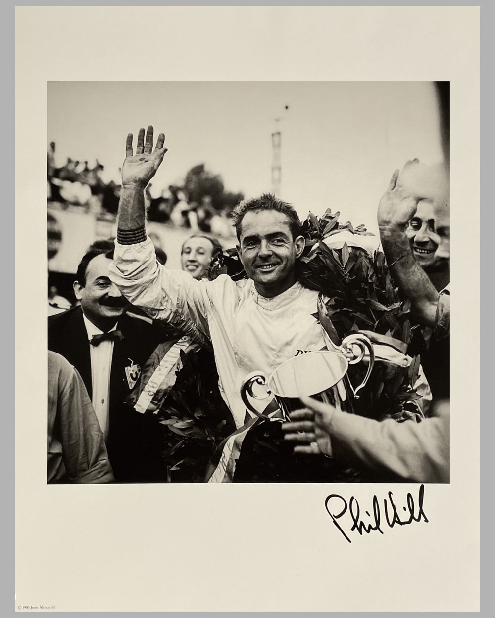 Phil Hill at his first Formula 1 Grand Prix win b&amp;w photograph by Jesse Alexander, autographed by Hill