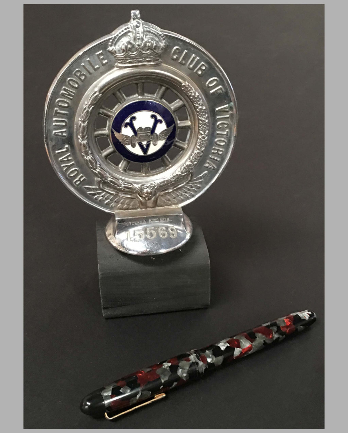 Royal Automobile Club of Victoria Australia hood ornament on wooded base, front