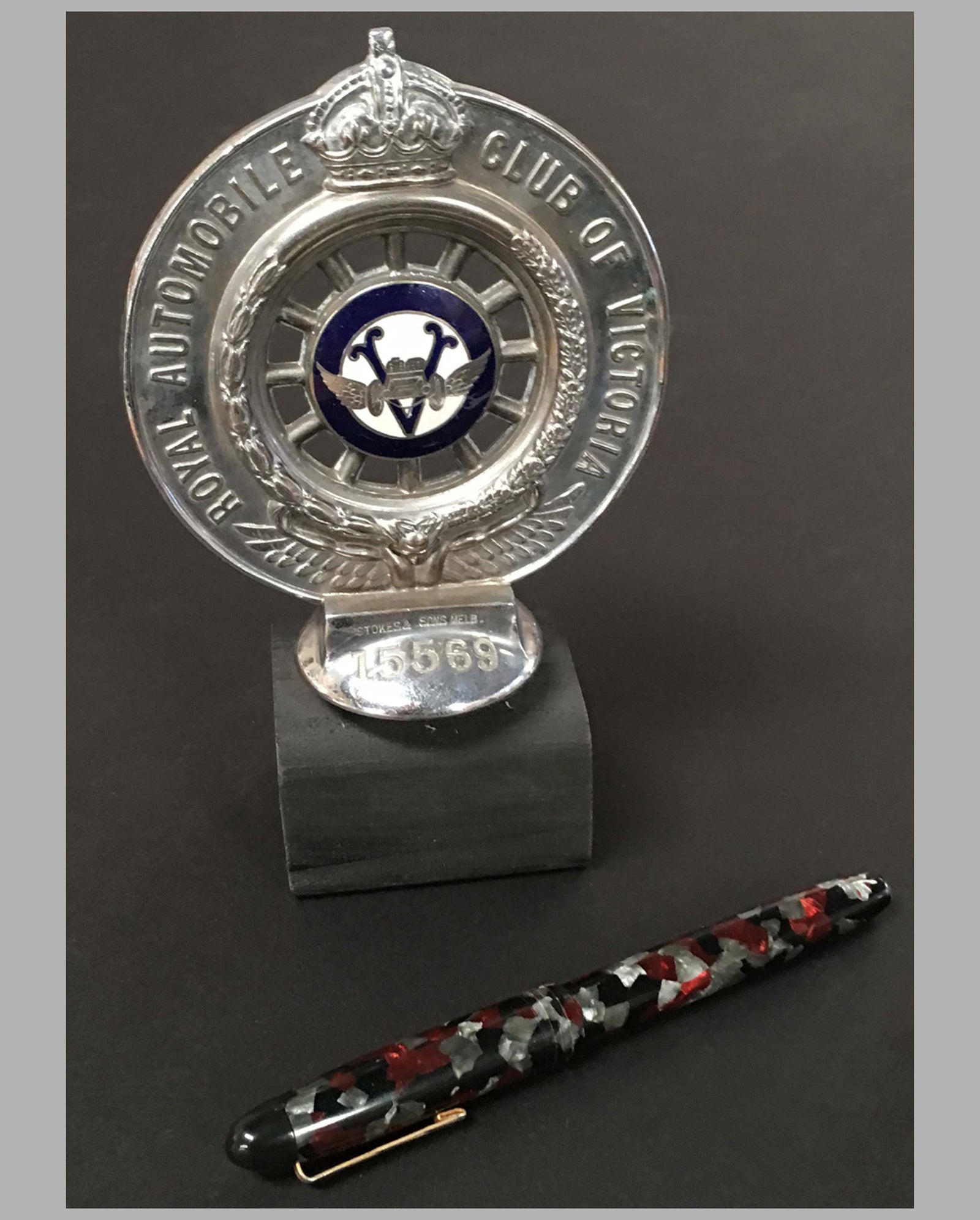 Royal Automobile Club of Victoria Australia hood ornament on wooded base, front