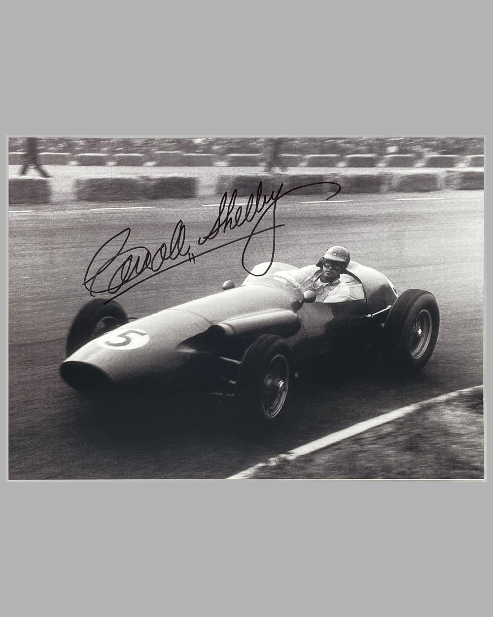 Carroll Shelby driving his Aston Martin DBR1 Formula 1 car, autographed b&amp;w photograph