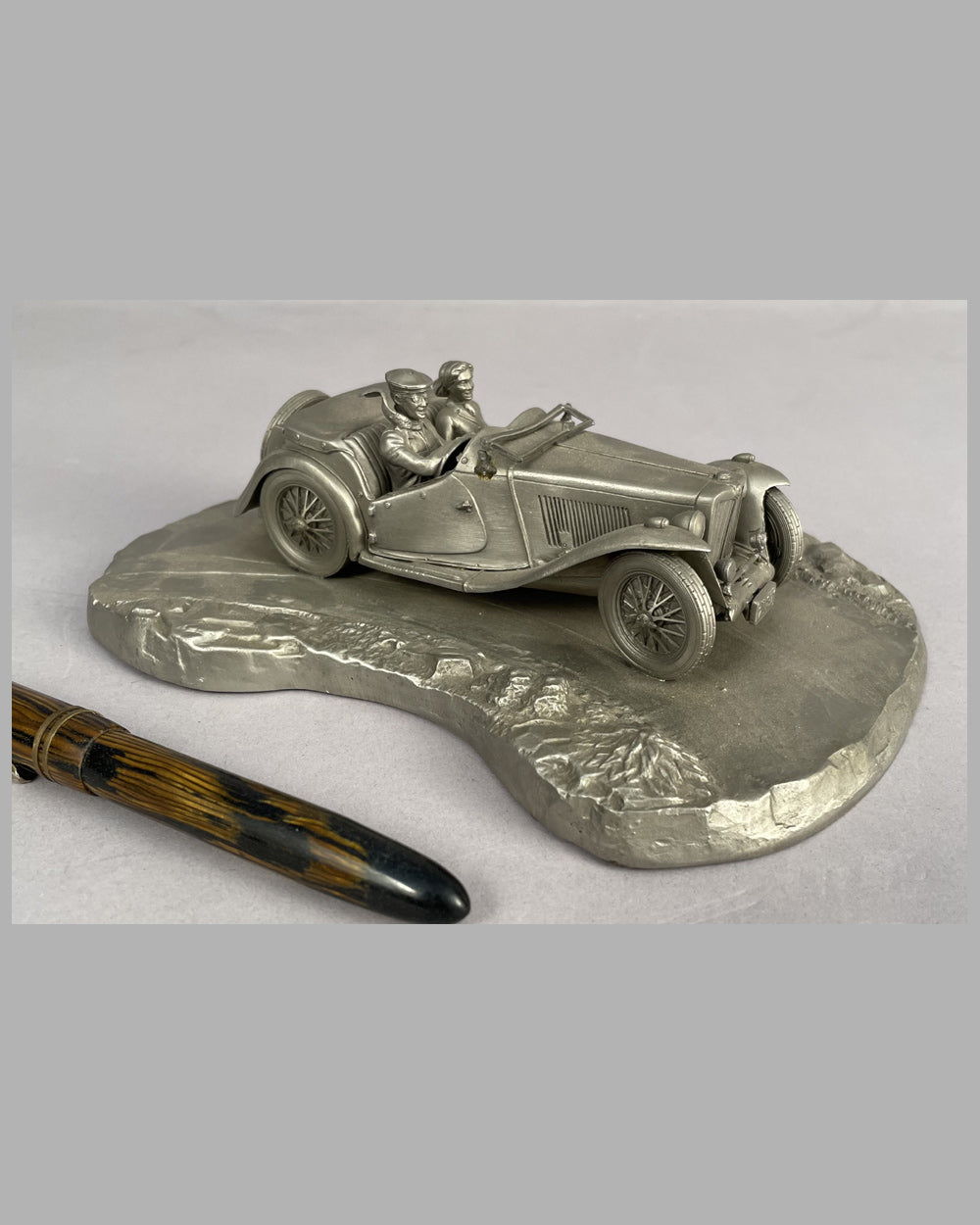 Taking the Curve pewter sculpture by Raymond Meyers, 1978